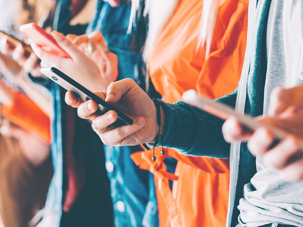 group of people on their mobile devices