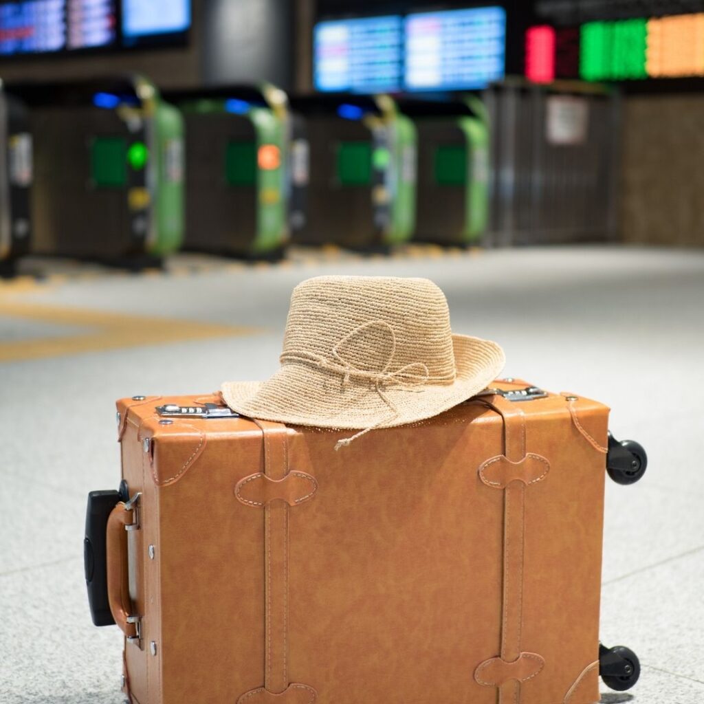 hat on luggage