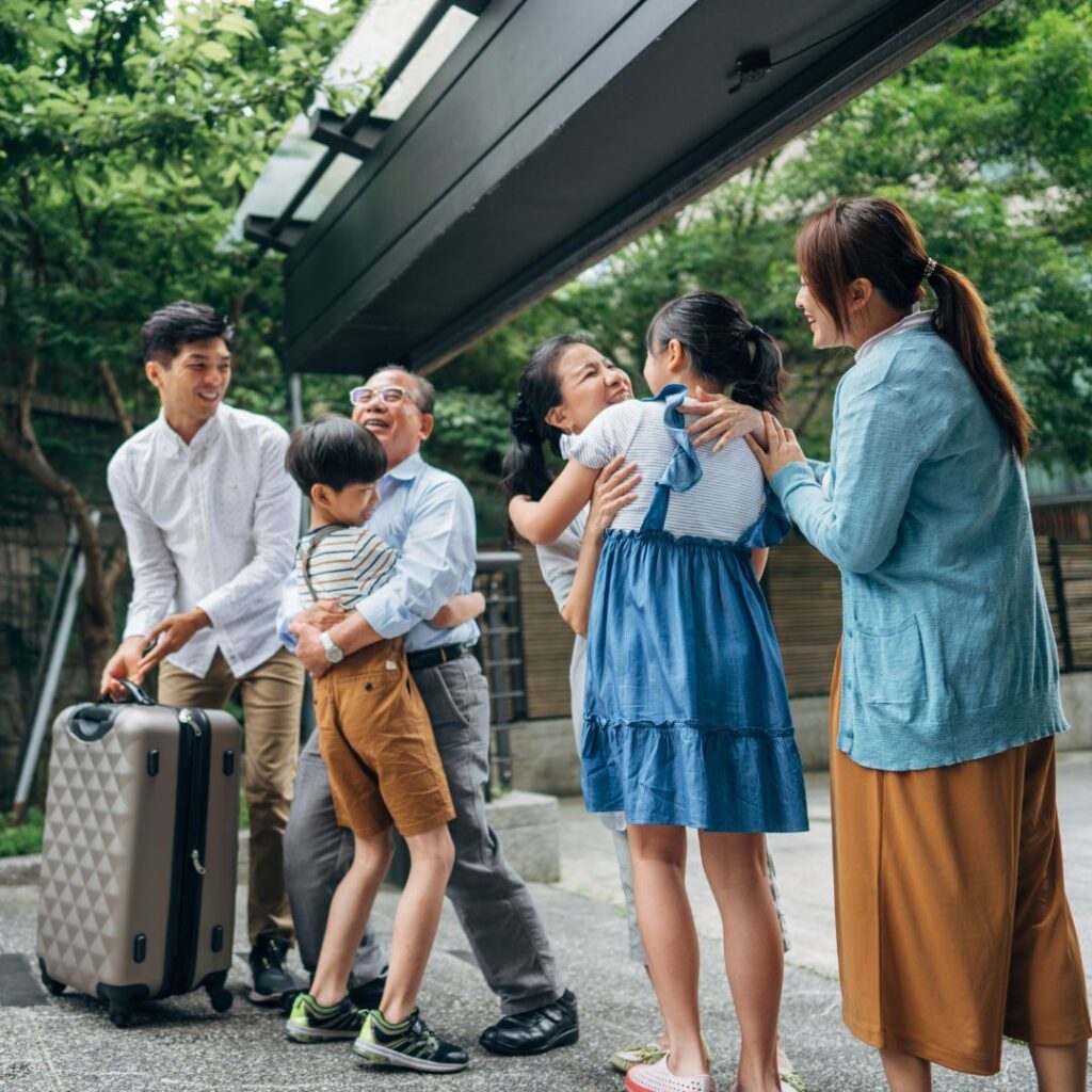 A group of people standing around each other.